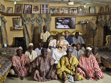 Alhaji Alhassan Sule (dob Nov. 5, 1926), from the Abudu family, a Dagomba divisional chief (Nantong Naa) with members of his court and photographer Jan Banning.      The Sweating Subject is a small se...
