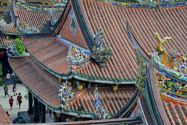 A detail of the decorative ceramic tiles on the roof of the Bao An Temple. The temple was constructed in 1742 and inducted into UNESCO for cultural heritage conservation in 2003.