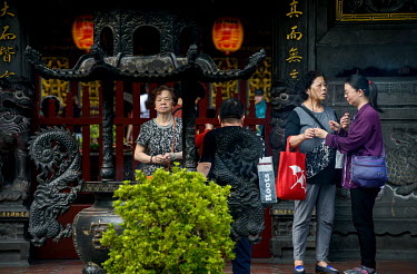 Worshippers light incense at the historic Bao'An Temple. The temple was constructed in 1742 and inducted into UNESCO for cultural heritage conservation in 2003.