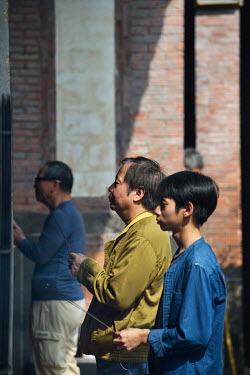 Worshippers at the historic Bao'An Temple, constructed in 1742 and inducted into UNESCO for cultural heritage conservation in 2003.