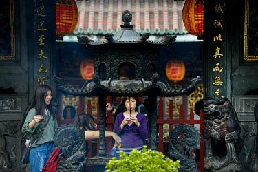 Worshippers light incense at the historic Bao'An Temple. The temple was constructed in 1742 and inducted into UNESCO for cultural heritage conservation in 2003.