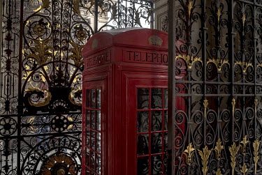 The original wooden prototype of a K2 telephone kiosk positioned at the entrance to the Royal Academy on Piccadilly.