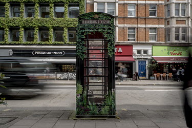 A Post Office telephone kiosk on Southampton Row in Bloomsbury. The k6 variant of the iconic telephone box was given a new lease of life as public art by artist Andrea Tyrimos who was commissioned to...