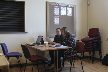 A woman gets help with writing a CV and applying for work at a 'job club' run by the charitable organisation the East Durham Trust.