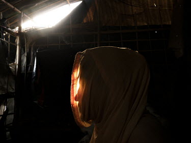 Maryam [name changed to protect her identity] in a refugee camp in Cox's Bazar. Sitting in her bamboo and plastic shelter in a refugee camp in Bangladesh, Maryam recounts the events that forced her fr...
