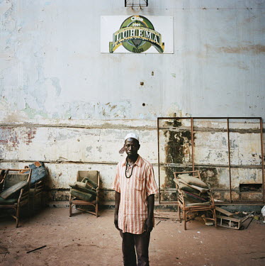 Soumaila (43), who works for the local football club, in an old warehouse used to prepare food.