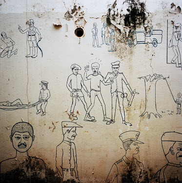 Graffiti in the yard of 'Casa dos Direitos' representing Portuguese colonialism.