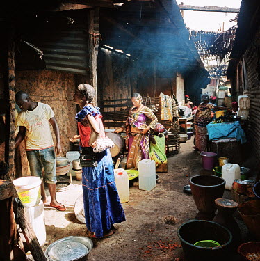 A narrow space behind the central market which is used to prepare food sold from stalls inside the market.