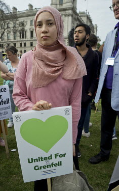 A rally in Parliament Square held by survivors, and their supporters, of the Grenfell Tower fire.