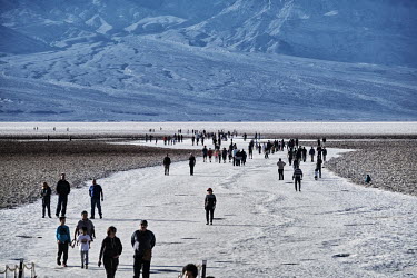 Tourists wander around the Badwater Basin in the Death Valley National Park.