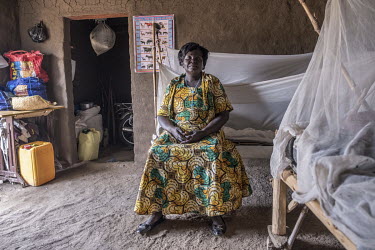 Lona Kiji, 45, in her new home in Bidibidi refugee camp. She fled here in September 2016 when violence swept through Central Equatoria State in South Sudan. 'When you step on death, you run', she said...