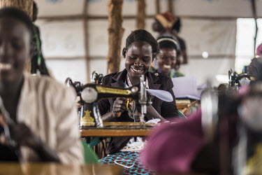 Nancy Tabu, a young single mother living in Bidibidi refugee camp takes part in a tailoring class, learning, among other things, how to make reusable sanitary pads to sell.