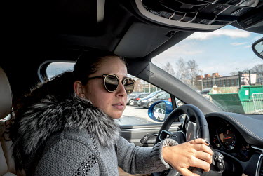 Tennis player Jelena (Alona) Ostanpenko driving through central Riga on her way to a dance class.
