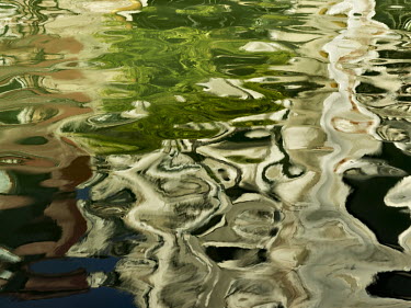 Ripples and reflections of buildings on a canal in sestiere (district) San Polo.
