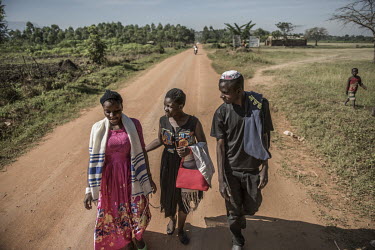Ugandan Jews chat as they walk to a local Synagogue.The Abayudaya (meaning the 'people of Judah', in the local language) form a tiny and isolated Jewish community living in just a handful of villages...