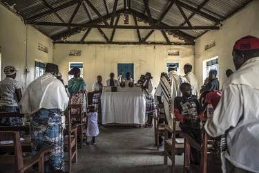 A crowded Synagogue in Namanyoni, where local religious leader Eliah Muamba frequently addresses crowds of well-over a hundred people for the Sabbath service. The community is currently constructing a...