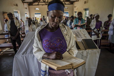 A Ugandan teen reads aloud in a synagogue in Namanyoni synagogue. The Abayudaya (meaning the 'people of Judah', in the local language) form a tiny and isolated Jewish community living in just a handfu...