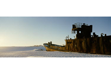The rusting hulk of a ship left stranded in the desert, over 100 kilometres from the current waters of the shrunken Aral Sea.