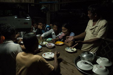 Srey Yen and her comrades eat dinner at the HALO trust camp beside Chomka Chek minefield (K-5 barrier minefield) on the Tha-Cambodian border.