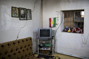 A television and a Kurdish flag in a refugee's house in Grdachal Refugee Camp.