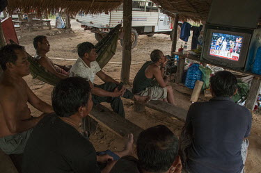 At a HALO camp deminers relax by watching Cambodian kick-boxing on a TV near the Chomka Chek minefield (part of the K-5 barrier minefiled) on the Thai-Cambodian border.