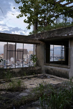 The roof terrace at the former Le President Hotel which was used by the American military in the 1960s up until the evacuation of 1975. Many of the rooms in the dilapidated building were then let chea...