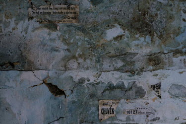 A few tattered remains of notices cling to a wall in the former Le President Hotel building which once stood at 727 Tran Hung Dao. It was used by the American military in the 1960s up until the evacua...