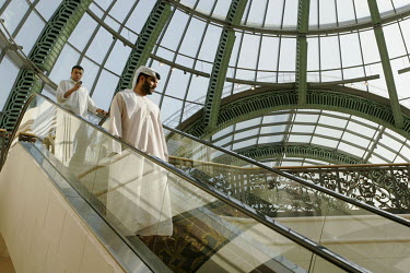People using an escalator at the Mall of the Emirates.