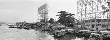 Advertising rigs on the banks of the Saigon River.