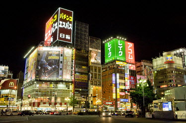 Illuminated advertisements cover the buildings in Shinjuku.