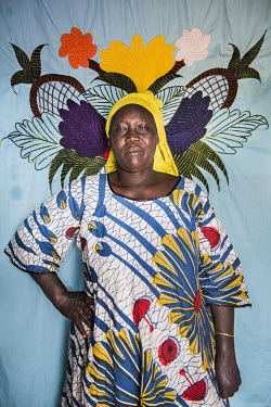Anite Leila (42)in front of her Milaya (a traditional hand-decorated sheet) in the Bidibidi refugee settlement. "Only god knows why I'm here. When the war started I had no idea that I was in the middl...