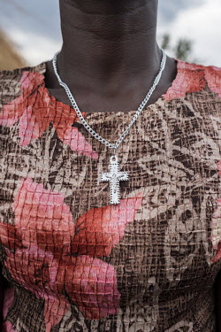 A silver crucifix worn by Yeime Keyawe from Yei, South Sudan, as she visits the Siona Church in Bidibidi zone 2.