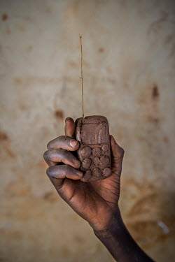 A toy phone made out of clay by Julius Caesar (8) a refugee from South Sudan living in the Bidibidi refugee settlement.