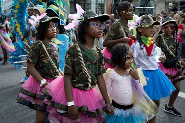 A group of young girls dance in the procession for the Hackney Carnival.