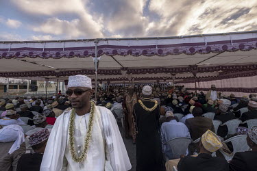 Friends and family of the bride and groom, along with local dignitaries attend the ceremony of 'Madjiliss', one of many events that take place during the course of a 'grand marriage' in the Comoros is...