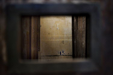A view through a cell door at the Tuol Sleng Genocide Museum (S21).
