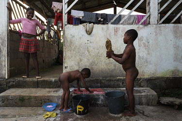 Children wash their clothes at the end of the day at the Notre Dame orphanage and school.