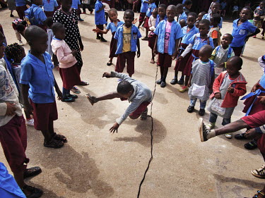 Children dancing in the schoolyard after the lesson at the Notre Dame orphanage and school.