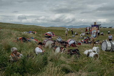Members of the Orange Order rest in a field during the first 12th July Parade of the year at Rossknowlagh in the Irish republic. The 12th July marches are held by the Protestant community to celebrate...