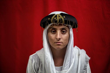 Yazidi Nadia Daalo Mosa (16) was held by ISIS for a week during which they cut the leg of her father and they killed a lot of their family.   This photograph is from a collaboration between Hossein Fa...