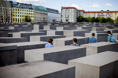A father and his three sons visits 'The Memorial to the Murdered Jews of Europe', the Berlin Holocaust Memorial.