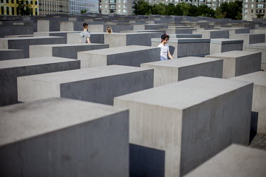 Visitors at the 'The Memorial to the Murdered Jews of Europe', the Berlin Holocaust Memorial.