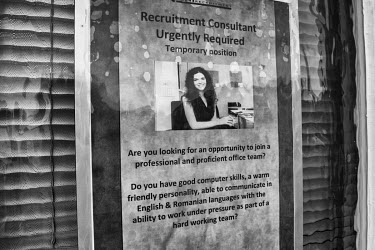 A poster in an office window near the town centre advertising a job, for a speaker of English and Romanian. According to census data, from 2011, there 65,000 people in the area, but Boston Council cla...