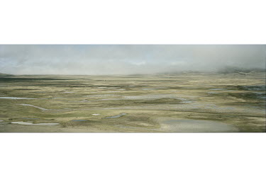 A wetland in Sanjiangyuan National Nature Reserve shows signs of desertification as an early morning fog lifts.   According to a 2015 report by the Chinese Academy of Sciences, the Qinghai Plateau i...