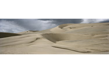 Sand Dunes in the Sanjiangyuan National Nature Reserve. Loose, dry surface sediments and strong winds are primary factors responsible for aeolian desertification, which is exacerbated by periodic drou...