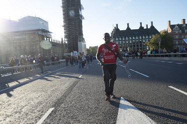 Femi Oluwole, 'a British political activist and co-founder of the pro-European Union advocacy group, Our Future Our Choice', crossesWestminster Bridge during a rally demanding a further, so-called 'pe...