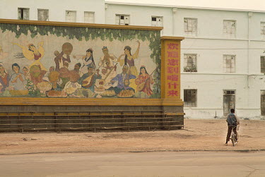 A mural depicting Uyghur musicians and dancers near a housing estate on the outskirts of Kashgar.