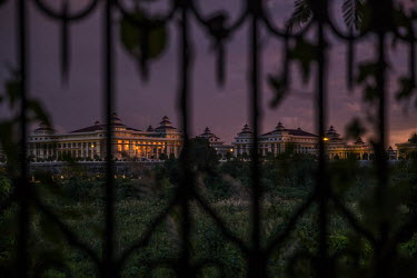 A view through its gates at sunset of the parliamentary buildings complex.