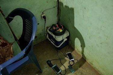 Mobile phones charging from a solar powered supply.
