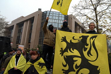 The flag of Flanders is prominent as a crowd, estimated at about 5000 people, held a rally against the UN migration pact signed a week before by a Belgian minority government. According to the Flemish...